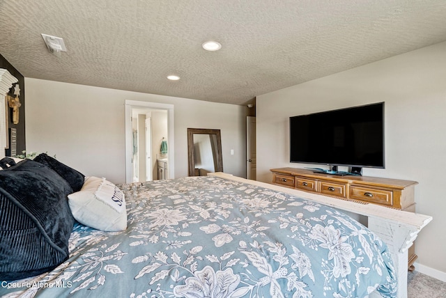 4483 N Connery Loop, Post Falls, ID 83854 - bedroom with recessed lighting, carpet floors, a textured ceiling, and connected bathroom