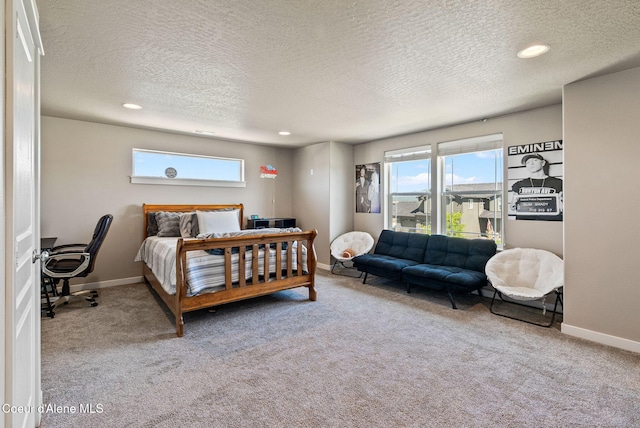 4483 N Connery Loop, Post Falls, ID 83854 - carpeted bedroom featuring multiple windows, a textured ceiling, recessed lighting, and a desk