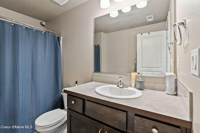 4483 N Connery Loop, Post Falls, ID 83854 - full bath featuring vanity, decorative backsplash, a textured ceiling, a shower with shower curtain, and a textured wall