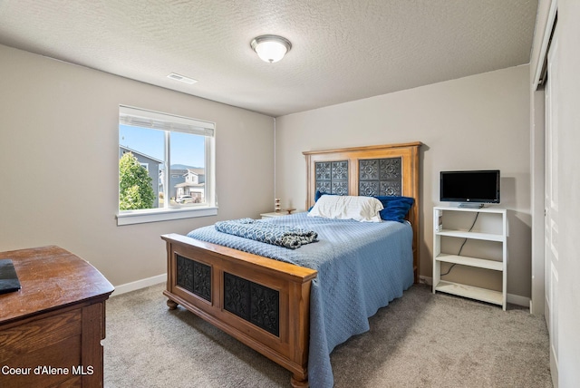 4483 N Connery Loop, Post Falls, ID 83854 - carpeted bedroom with baseboards and a textured ceiling
