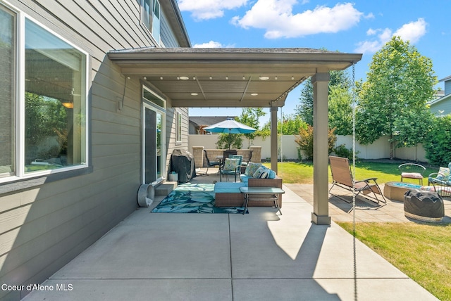4483 N Connery Loop, Post Falls, ID 83854 - fenced backyard with a patio and outdoor lounge area