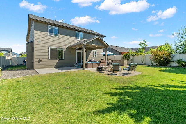4483 N Connery Loop, Post Falls, ID 83854 - rear view of house with a patio area, a fenced backyard, and an outdoor hangout area