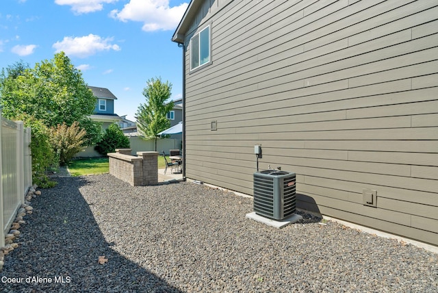 4483 N Connery Loop, Post Falls, ID 83854 - view of side of property featuring a central AC unit and a patio area