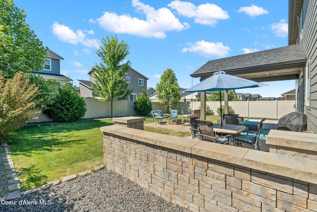 4483 N Connery Loop, Post Falls, ID 83854 - fenced backyard featuring a patio, an outdoor living space, and a residential view