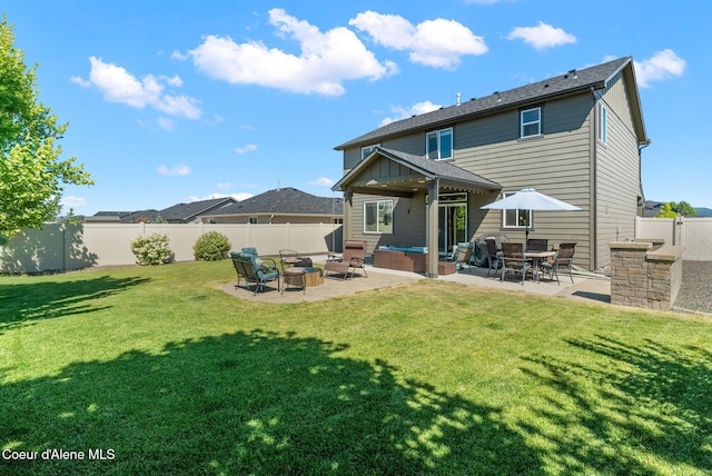 4483 N Connery Loop, Post Falls, ID 83854 - rear view of property featuring a patio area, a fenced backyard, and an outdoor living space with a fire pit
