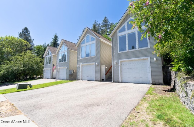 2015 N 13th St, Coeur Dalene, ID 83814 - view of front of property with a garage and asphalt driveway