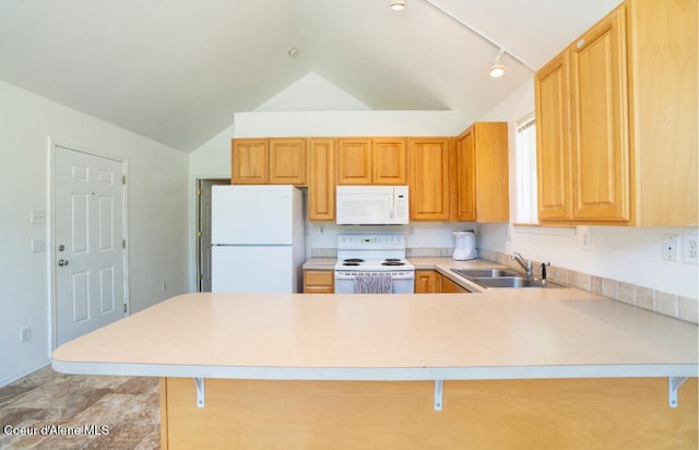 2015 N 13th St, Coeur Dalene, ID 83814 - kitchen featuring white appliances, a peninsula, vaulted ceiling, light countertops, and a breakfast bar