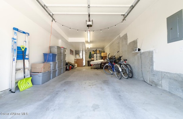 2015 N 13th St, Coeur Dalene, ID 83814 - garage featuring electric panel and a garage door opener