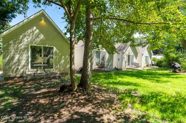 2015 N 13th St, Coeur Dalene, ID 83814 - view of home's exterior with a lawn and a patio
