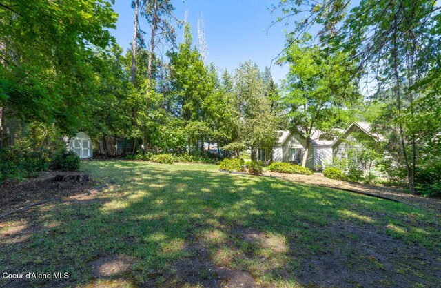 2015 N 13th St, Coeur Dalene, ID 83814 - view of grassy yard with a shed