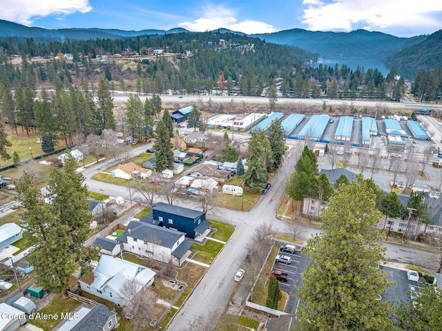 2119 E Lakeside Ave, Coeur Dalene, ID 83814 - aerial view of property's location featuring a mountain backdrop and a heavily wooded area