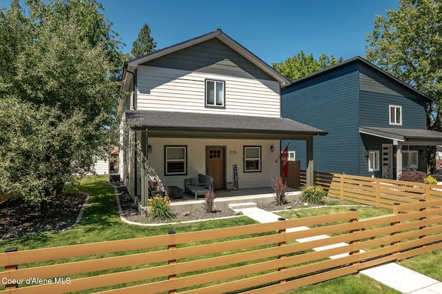 2119 E Lakeside Ave, Coeur Dalene, ID 83814 - view of front of home featuring a porch and a fenced front yard
