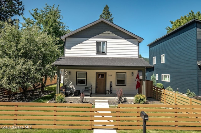2119 E Lakeside Ave, Coeur Dalene, ID 83814 - view of front of property featuring covered porch and a fenced front yard