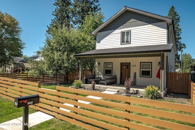 2119 E Lakeside Ave, Coeur Dalene, ID 83814 - view of front of house with a fenced front yard and covered porch