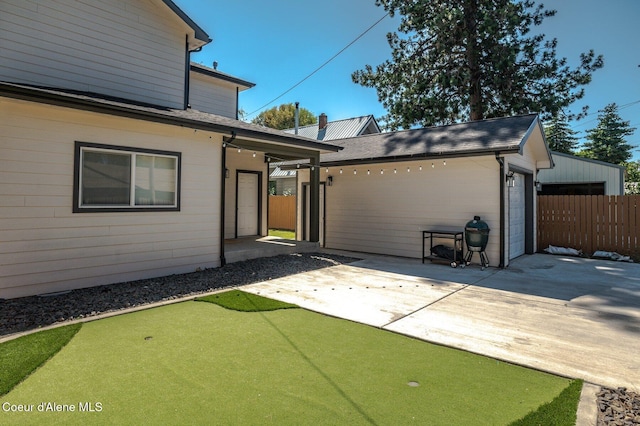 2119 E Lakeside Ave, Coeur Dalene, ID 83814 - view of front facade featuring a putting area, a patio, and roof with shingles