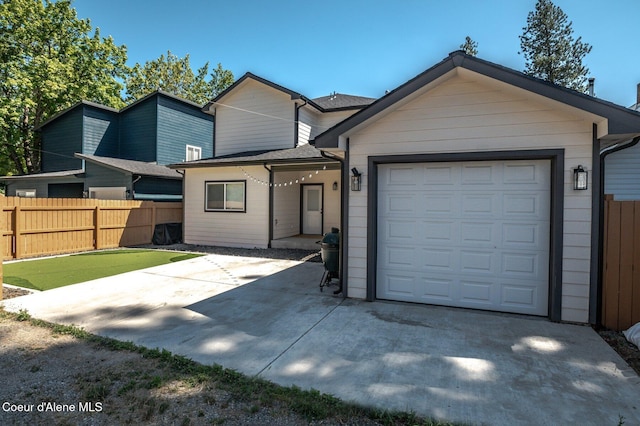 2119 E Lakeside Ave, Coeur Dalene, ID 83814 - view of front of house featuring a garage and driveway
