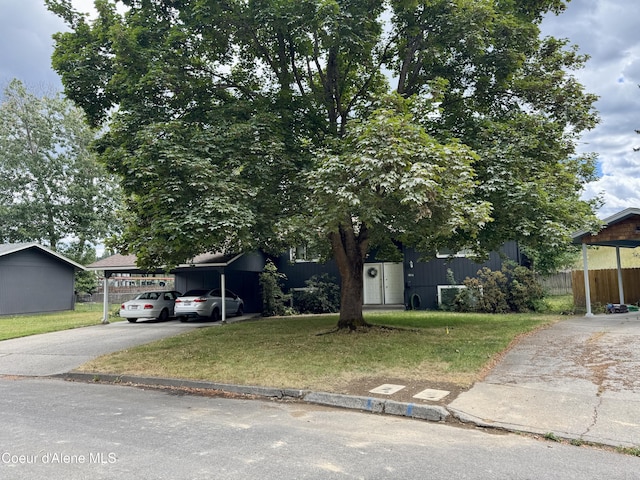 1816-1818 N Burl Ln, Coeur Dalene, ID 83814 - obstructed view of property with driveway and a carport