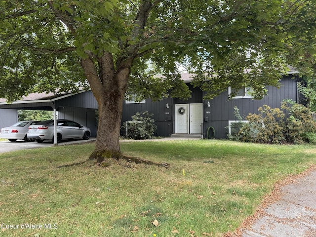 1816-1818 N Burl Ln, Coeur Dalene, ID 83814 - view of front facade with a front yard, an attached carport, and driveway