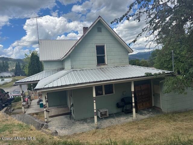 346S S 4th St, Saint Maries, ID 83861 - rear view of house with a metal roof and a chimney