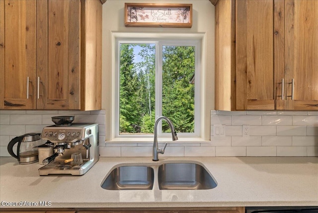 12671 E Trout Pond Rd, Athol, ID 83801 - kitchen with backsplash, brown cabinets, and dishwashing machine