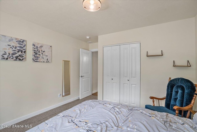 12671 E Trout Pond Rd, Athol, ID 83801 - bedroom with carpet, a closet, and a textured ceiling