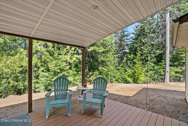 12671 E Trout Pond Rd, Athol, ID 83801 - wooden terrace with a patio