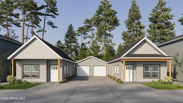 349 Jasper Loop, Ponderay, ID 83852 - modern farmhouse with an outdoor structure, a garage, board and batten siding, and a shingled roof