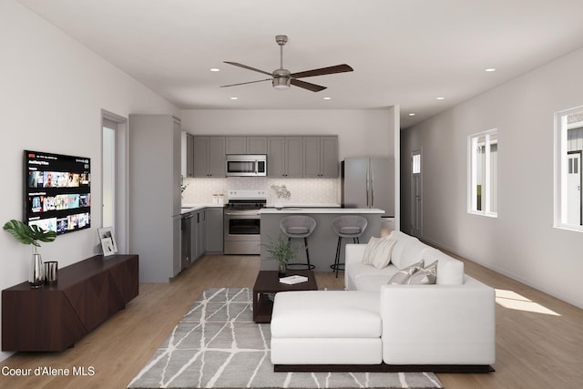 349 Jasper Loop, Ponderay, ID 83852 - living area with light wood-style flooring, a ceiling fan, and recessed lighting