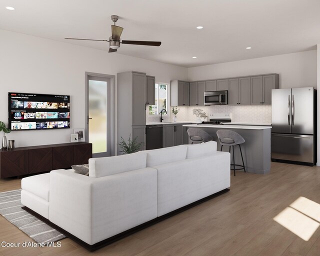 349 Jasper Loop, Ponderay, ID 83852 - living area featuring light wood finished floors, a ceiling fan, and recessed lighting