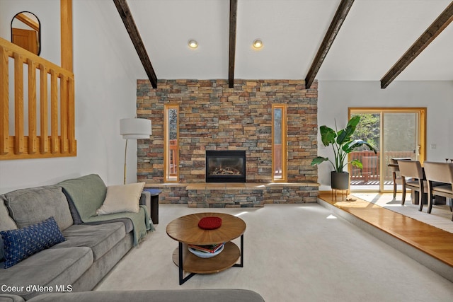 23388 N Teddy Loop, Rathdrum, ID 83858 - carpeted living room with beam ceiling and a fireplace