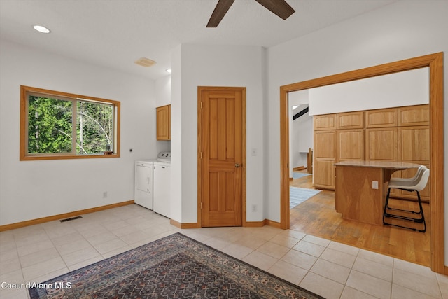 23388 N Teddy Loop, Rathdrum, ID 83858 - laundry area featuring cabinet space, washing machine and dryer, a ceiling fan, light tile patterned flooring, and recessed lighting