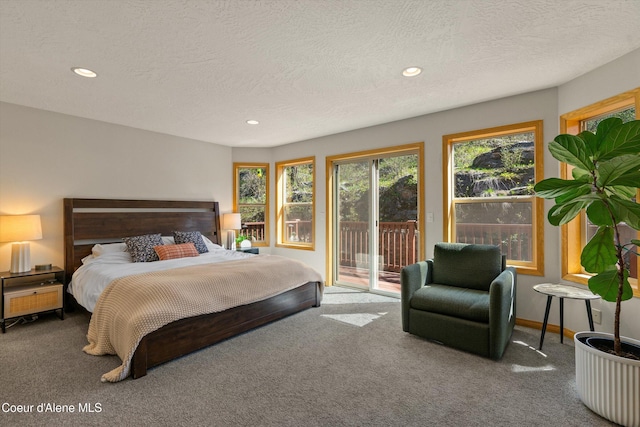 23388 N Teddy Loop, Rathdrum, ID 83858 - carpeted bedroom featuring access to exterior, recessed lighting, and a textured ceiling