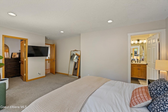 23388 N Teddy Loop, Rathdrum, ID 83858 - bedroom with light colored carpet, recessed lighting, and ensuite bathroom