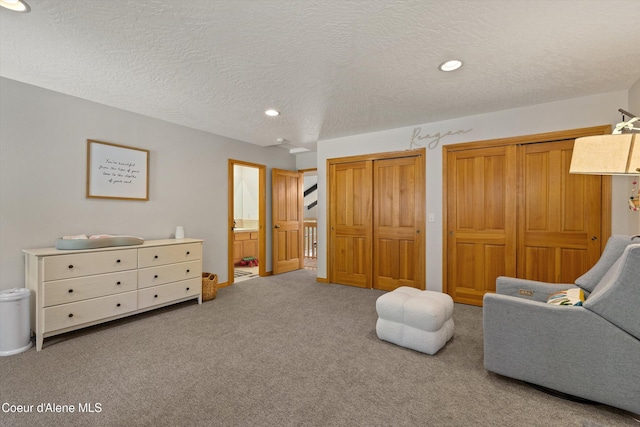 23388 N Teddy Loop, Rathdrum, ID 83858 - sitting room with carpet flooring, a textured ceiling, and recessed lighting