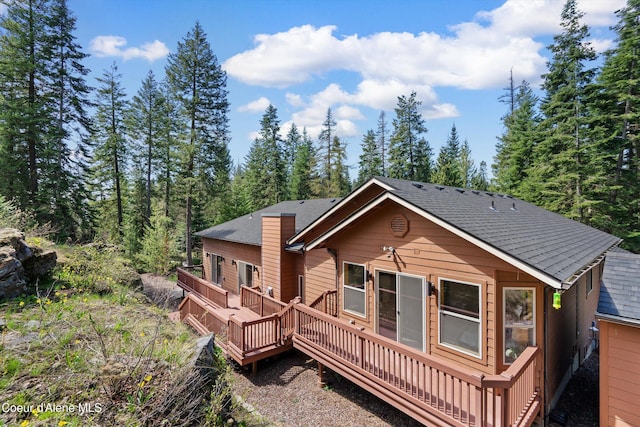 23388 N Teddy Loop, Rathdrum, ID 83858 - back of property with a wooden deck and roof with shingles