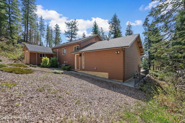 23388 N Teddy Loop, Rathdrum, ID 83858 - rear view of house with a shed