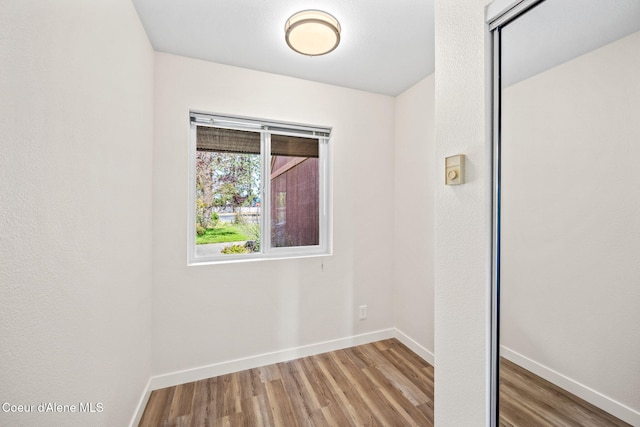 628 E Timber Ln, Coeur Dalene, ID 83815 - unfurnished room featuring wood finished floors