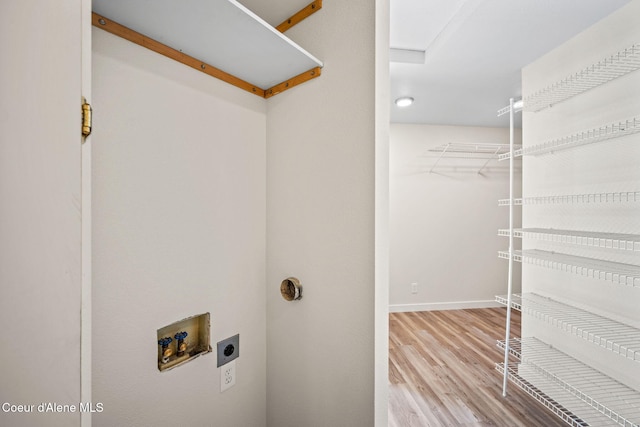 628 E Timber Ln, Coeur Dalene, ID 83815 - washroom featuring hookup for an electric dryer, washer hookup, and wood finished floors