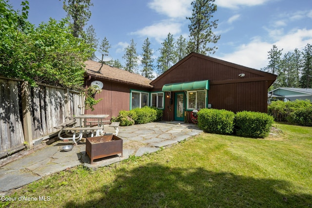 628 E Timber Ln, Coeur Dalene, ID 83815 - rear view of house with a patio area