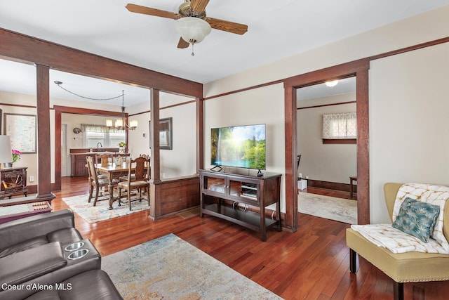 105 E Miller Ave, Coeur Dalene, ID 83814 - living room featuring wood finished floors, ceiling fan, a chandelier, and healthy amount of natural light