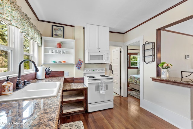 105 E Miller Ave, Coeur Dalene, ID 83814 - kitchen featuring white appliances, open shelves, dark wood finished floors, crown molding, and white cabinetry