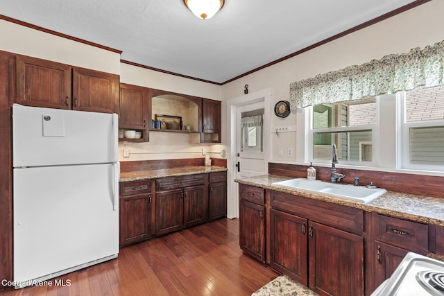 105 E Miller Ave, Coeur Dalene, ID 83814 - kitchen featuring freestanding refrigerator, open shelves, ornamental molding, and dark wood-type flooring