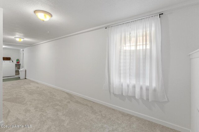 105 E Miller Ave, Coeur Dalene, ID 83814 - carpeted empty room featuring washer / dryer and baseboards