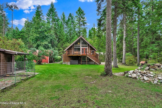 30553 N Stampede Rd, Athol, ID 83801 - rear view of property with stairway, a lawn, and a wooden deck