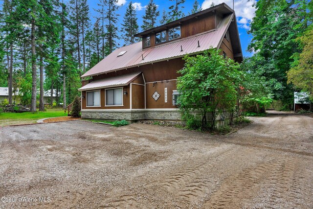 30553 N Stampede Rd, Athol, ID 83801 - view of front of house featuring dirt driveway and a metal roof