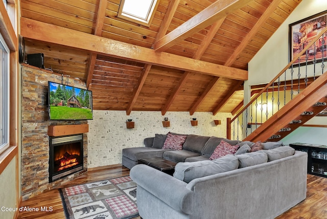 30553 N Stampede Rd, Athol, ID 83801 - living room with wood ceiling, wood finished floors, a stone fireplace, and stairway