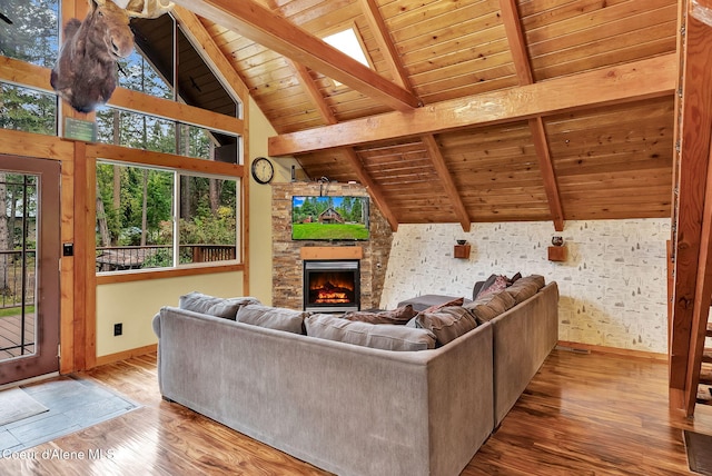 30553 N Stampede Rd, Athol, ID 83801 - living room with wooden ceiling, a stone fireplace, and wood finished floors