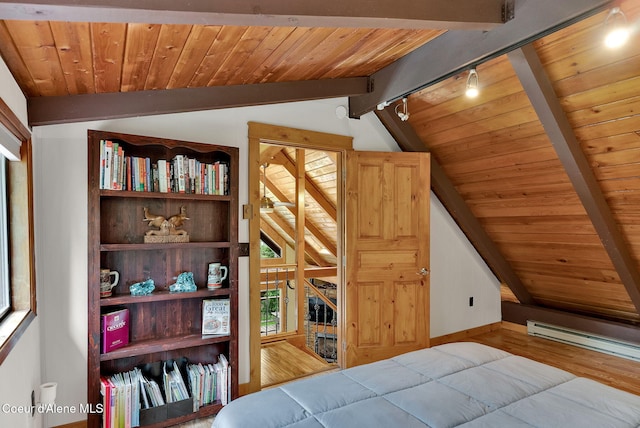 30553 N Stampede Rd, Athol, ID 83801 - bedroom featuring wood ceiling, rail lighting, wood finished floors, and a baseboard heating unit