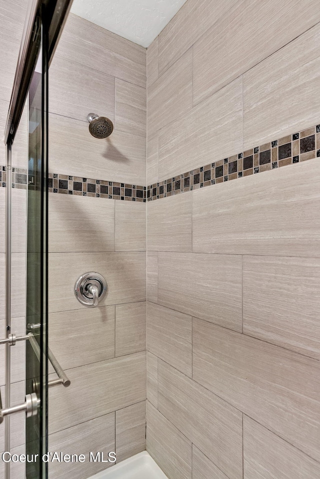 30553 N Stampede Rd, Athol, ID 83801 - full bathroom featuring tiled shower