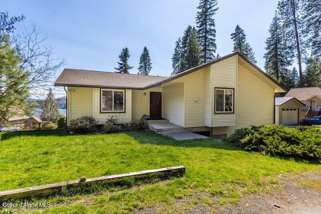 9218 W Rockford Bay Rd, Coeur Dalene, ID 83814 - view of front of house featuring a garage and a front yard